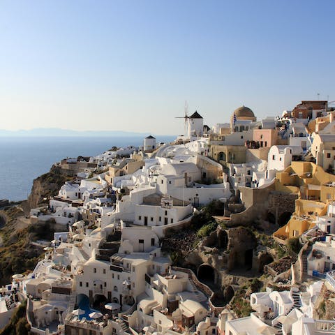 Explore the idyllic town of Oia, right on the Aegean Sea