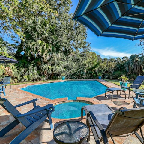 Relax by the pool, complete with an in-built hot tub