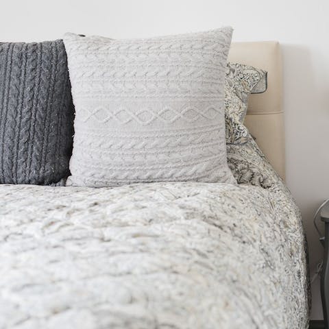 Rest up after a long day in the sumptuous beds adorned with William Morris duvets