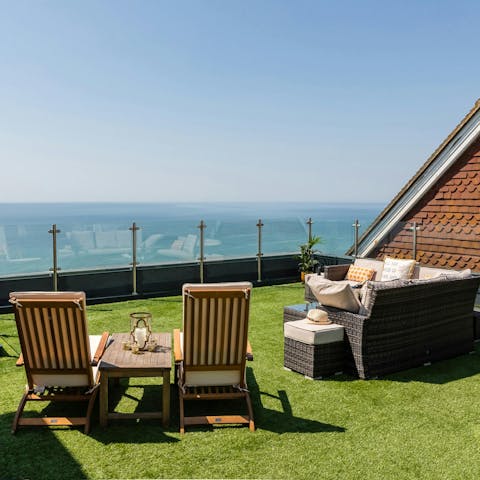 Savour sun set drinks while lounging on the roof terrace