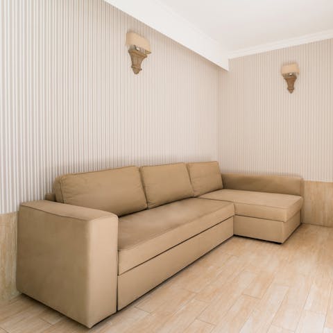 Relax on the sofa overlooking the garden at the end of a busy day