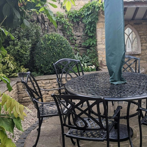 Savour a glass of wine in the small courtyard