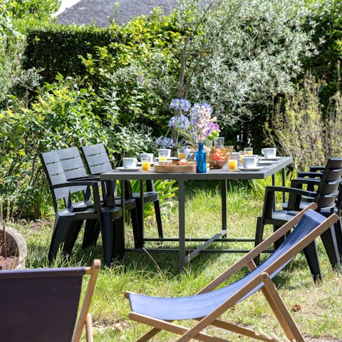 Gather for a meal in the flower-filled wild garden