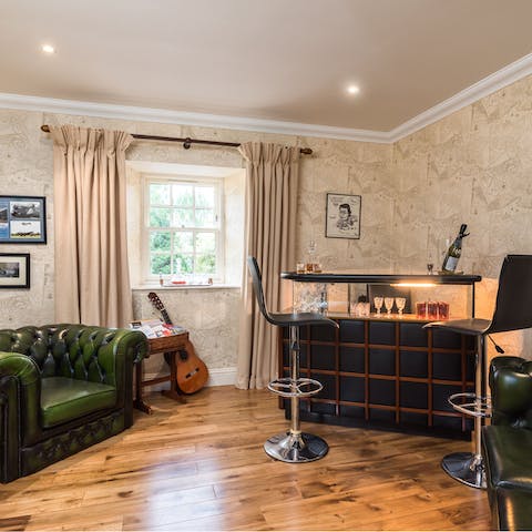 Fix up a drink in the stylish bar room with hand-picked furniture and artwork