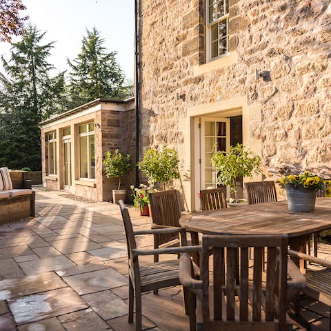 Enjoy an alfresco meal on the sunny patio area
