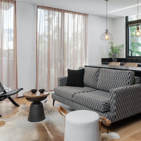 Get cosy in the bright and stylish living area