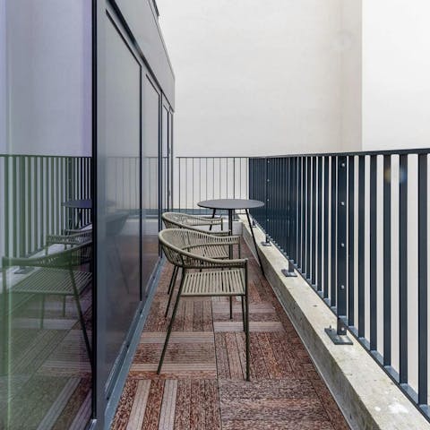 Savour a glass of wine on the small balcony