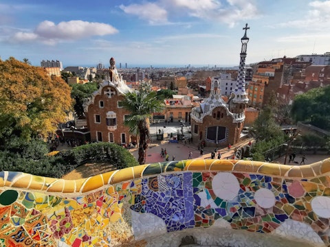 Wander Gaudí's whimsical mosaic terraces with sweeping city panoramas