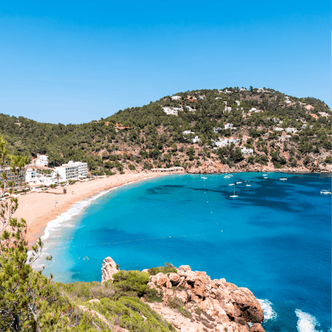 Spend leisurely days on Cala San Vicente beach, a fifteen-minute drive away