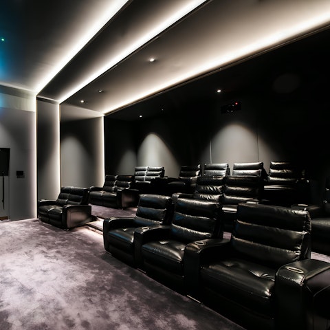 Unwind after a busy day with a movie in the on-site cinema room