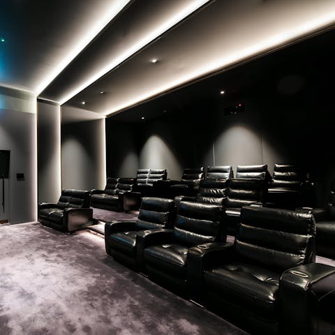 Unwind after a busy day with a movie in the on-site cinema room