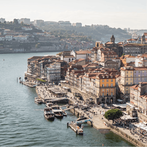 Wander through the atmospheric streets to the vibrant riverside Cais da Ribeira