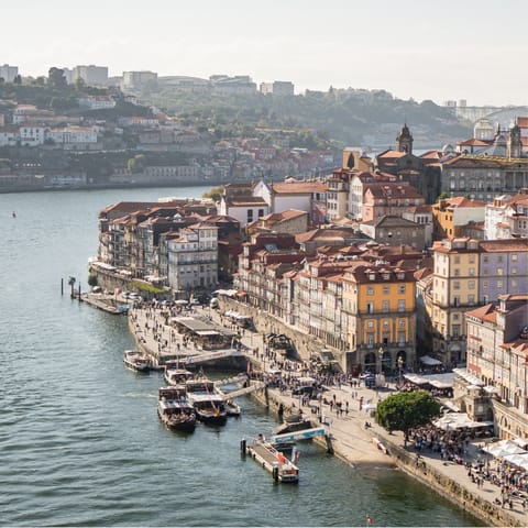 Wander through the atmospheric streets to the vibrant riverside Cais da Ribeira