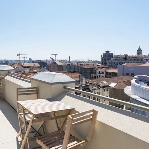 Step onto the balcony and feel serenaded by sweeping city views