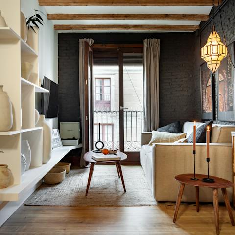 Relax in the bright living room with a glass of wine while a record serenades you