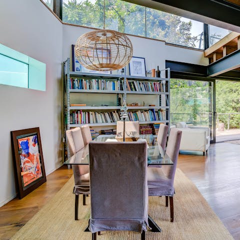Tuck into a fideuà in the dining area with its tall ceilings and bookcase