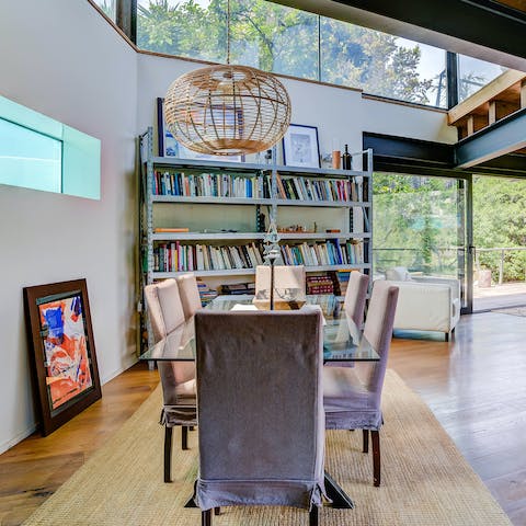 Tuck into a fideuà in the dining area with its tall ceilings and bookcase