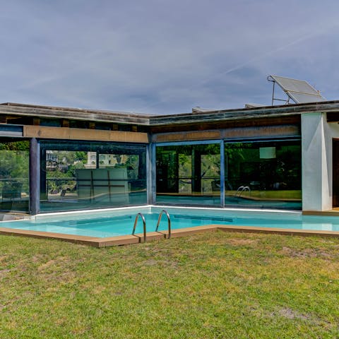 Cool off from the Catalan sun in the pool with its waterfall feature