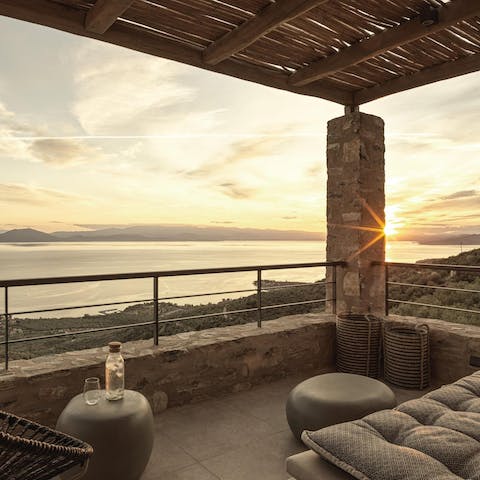 Admire the Pagasitic Gulf from the balcony seating