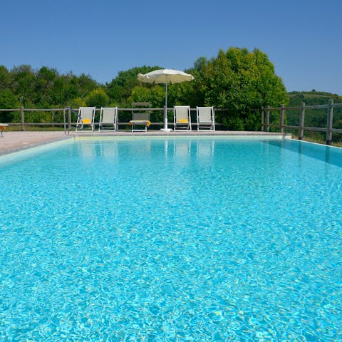 Slip into the crystal-clear waters of the private swimming pool