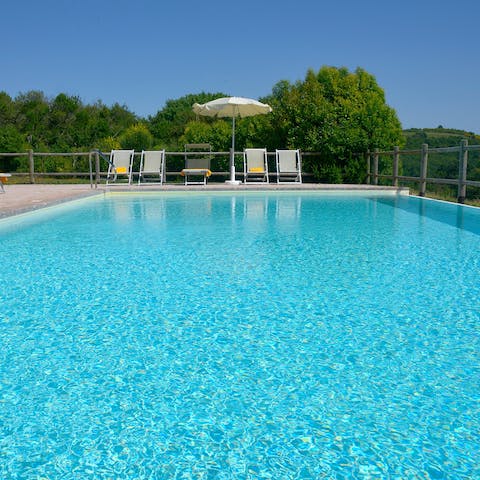 Slip into the crystal-clear waters of the private swimming pool