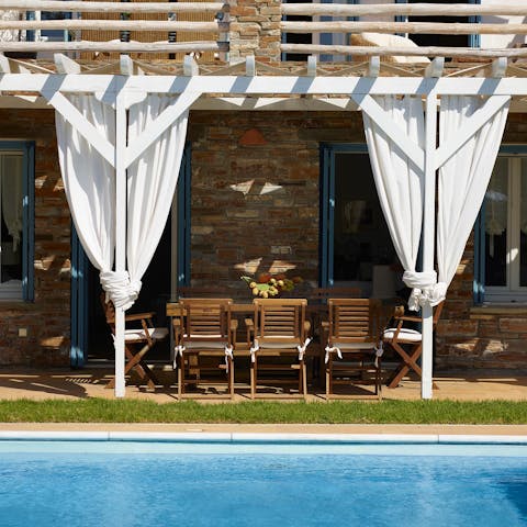 Look forward to alfresco dining under the wooden pergola