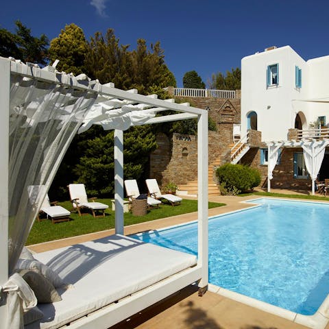 Soak up the sun relaxing on the day bed or swimming in the pool