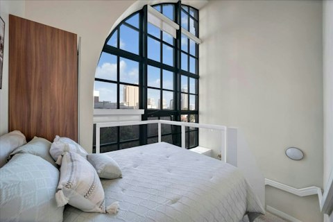 Wake to city views from the loft bedroom