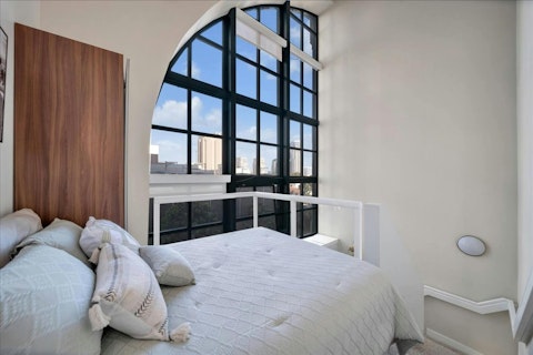 Wake to city views from the loft bedroom