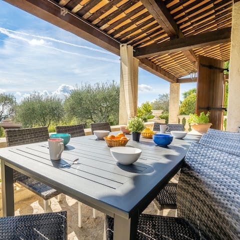 Serve a rustic feast to guests seated out on the covered terrace