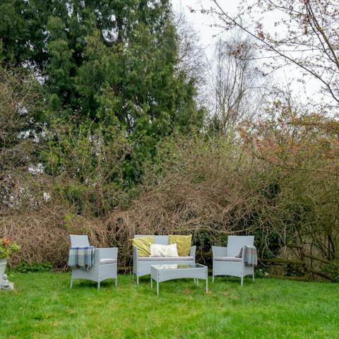 Sit out in the cottage's garden to make the most of the last of the day's sunshine