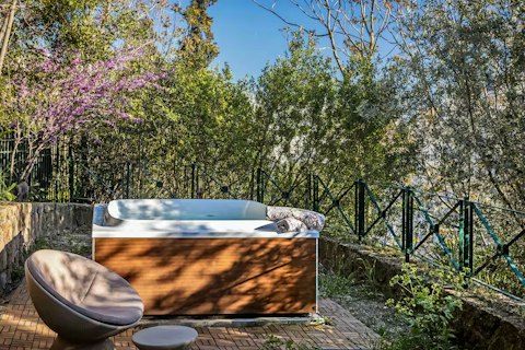 Step into the hot tub as the garden settles into stillness