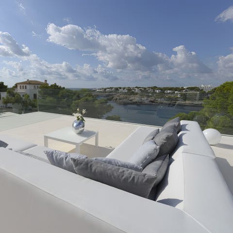 Soak up the bay views over a glass of wine on the balcony