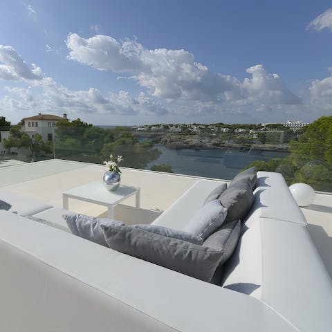 Soak up the bay views over a glass of wine on the balcony