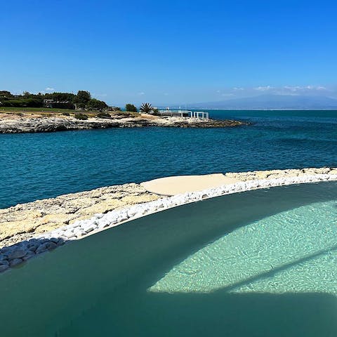 Unwind in the Jacuzzi or walk a few steps to the sea