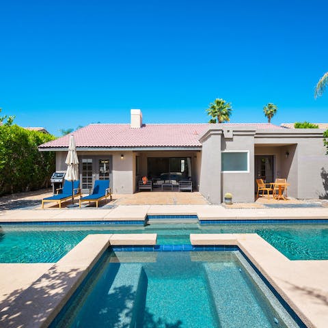 Choose between a cooling dip and a soothing soak in the Jacuzzi and pool