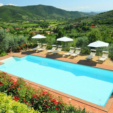Take a dip in the pool surrounded by verdant countryside