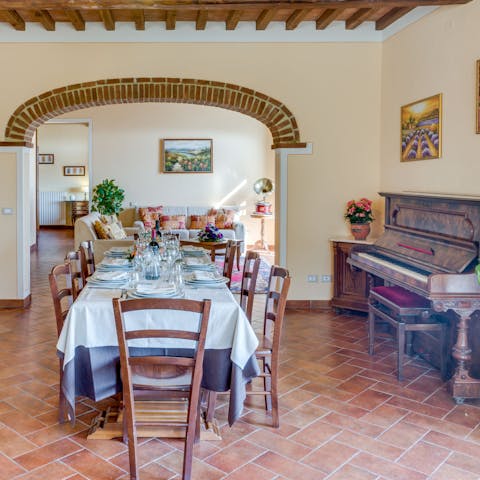 Gather around the table for dinner, then entertain you guests at the piano