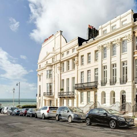 Stay in a beautiful Regency-style townhouse seconds from the beach