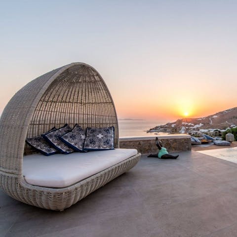 Grab a glass of wine and watch as the sun sets over the horizon