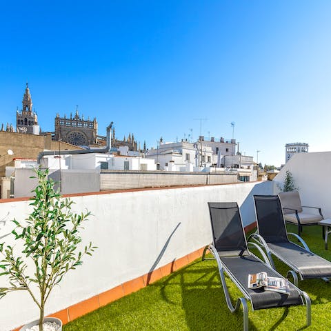 Take in the vistas of Seville Cathedral and the Giralda Tower from the private roof terrace