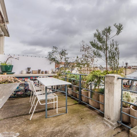 Take in views of Paris' rooftops and the Eiffel Tower from your private terrace