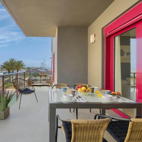 Sit out on the private balcony and enjoy alfresco meals with sea views