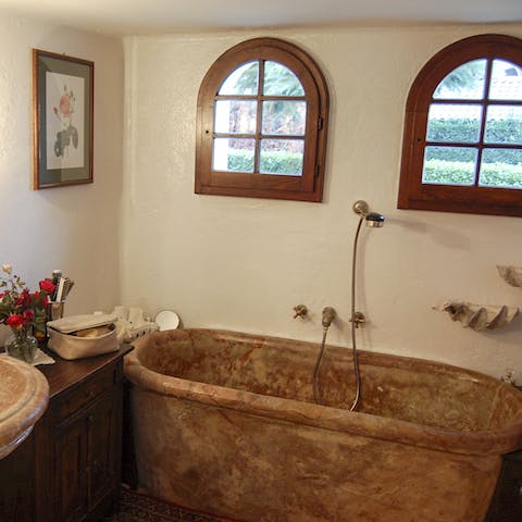 Soak your muscles in a stone tub