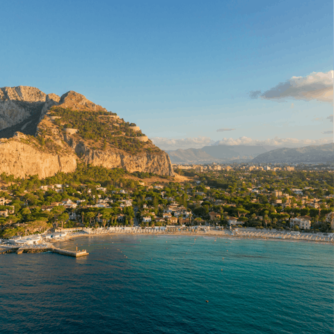 Enjoy a beach day in Mondello, a thirty-minute drive away