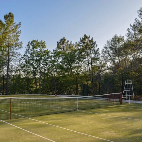 Play a game of tennis on the private court in the French sun