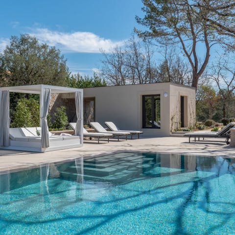 Relax by the pool with a glass of Provence wine