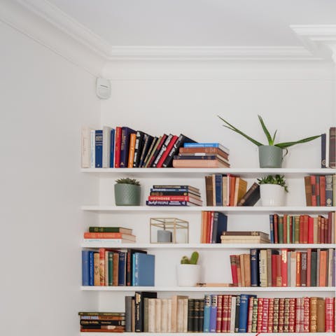 Dive into the book collection and spend a lazy morning reading on the sofa