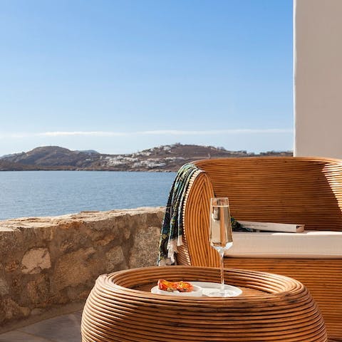 Settle down with a glass of wine and marvel at the sea