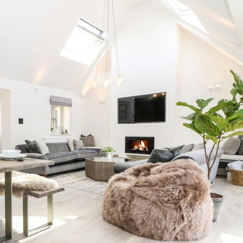 Savour evening drinks with a movie by the fire